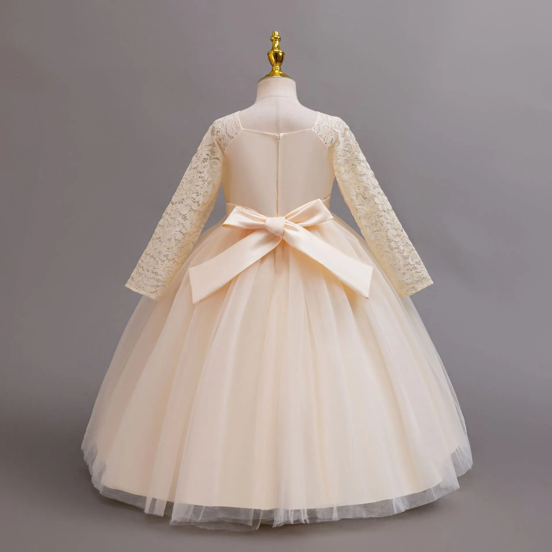 Long Sleeve Lace Flower Girl Gown with Full Tulle Skirt and Floral Accent