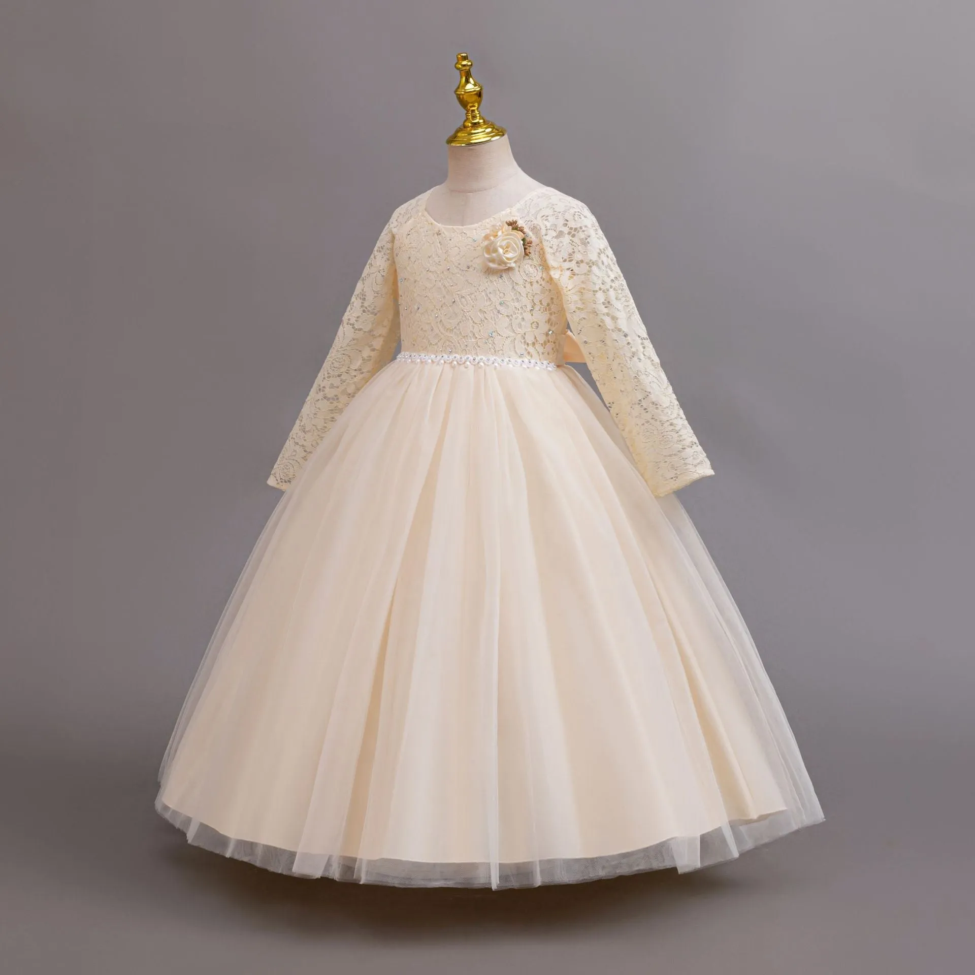 Long Sleeve Lace Flower Girl Gown with Full Tulle Skirt and Floral Accent